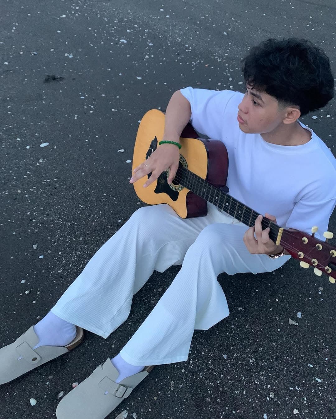 Beach with guitar in all white