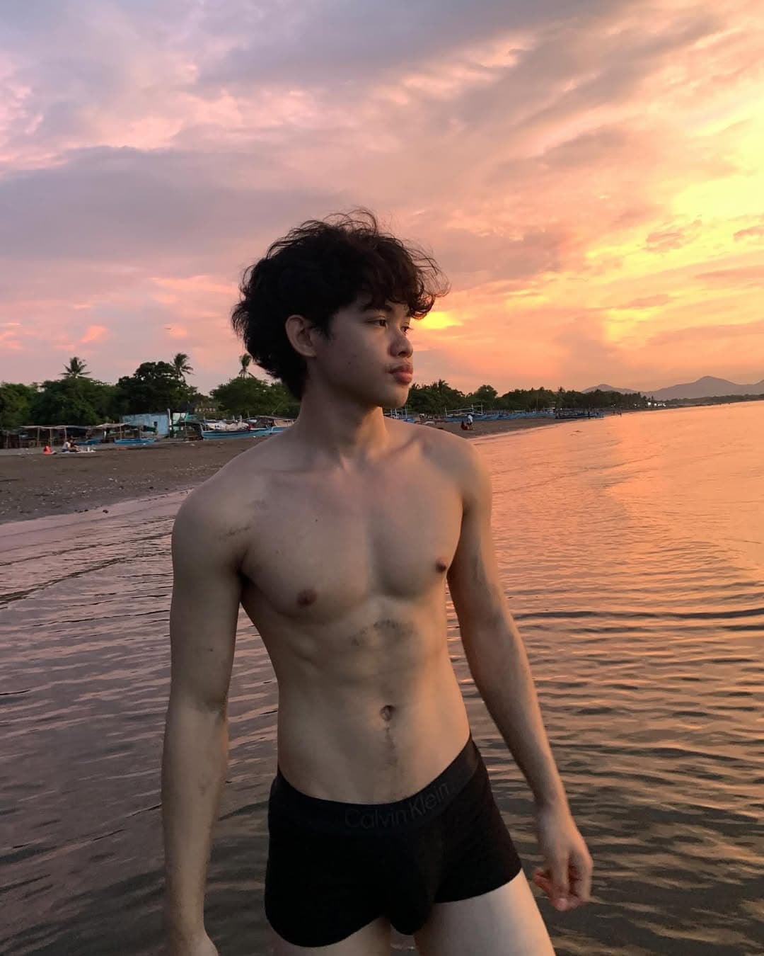 Beach physique at sunset with blow out taper